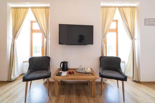 Μια τηλεόραση ή/και κέντρο ψυχαγωγίας στο Bed & breakfast Hugo