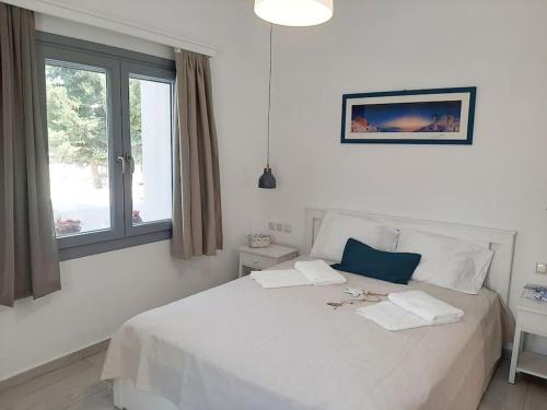 En eller flere senge i et værelse på Cozy town house