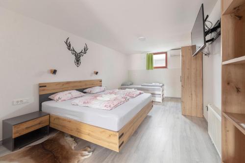 a bedroom with a large bed in a room at Apartma Naravni biser in Brezje