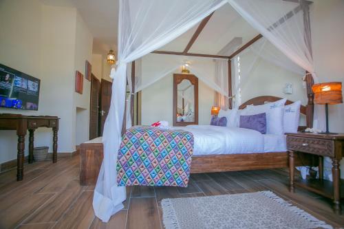 Ένα ή περισσότερα κρεβάτια σε δωμάτιο στο Mzima Beach Residences - Diani Beach