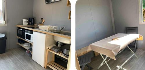 eine Küche mit einer Theke, einem Waschbecken und einem Tisch in der Unterkunft Logis des travailleurs in Sormery
