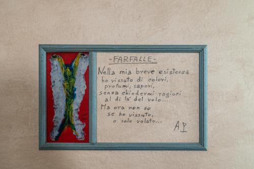 a framed picture of two pieces of art on a wall at Hotel Diana in Ravenna