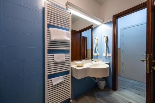 a bathroom with a sink and a mirror at Hotel Diana in Ravenna
