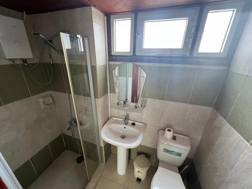 a bathroom with a toilet and a sink at Nostalgia Boutique Hotel Girne in Kyrenia