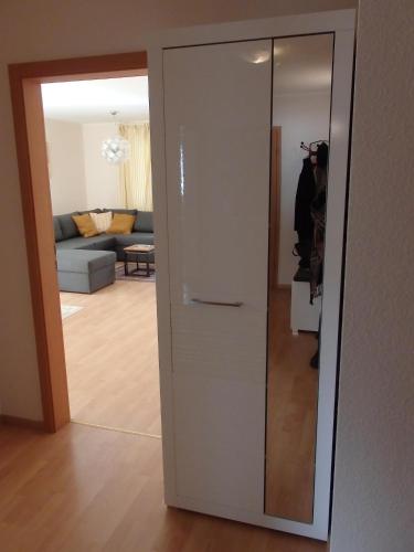 a sliding glass door leading into a living room at Ferienwohnung Bärensteinblick in Stadt Wehlen