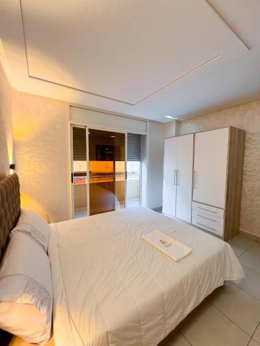 a bedroom with a large white bed in a room at Royal Rif Alhoceima in Al Hoceïma