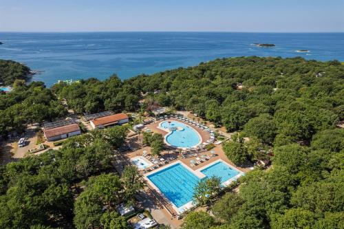 an aerial view of a resort with a swimming pool at SUNNY Mobile Homes Bijela Uvala in Poreč