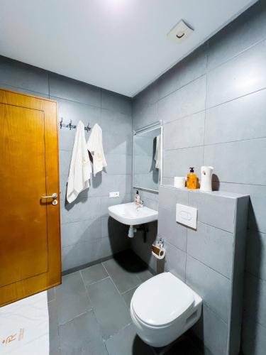 a bathroom with a toilet and a sink at Royal Rif Alhoceima in Al Hoceïma