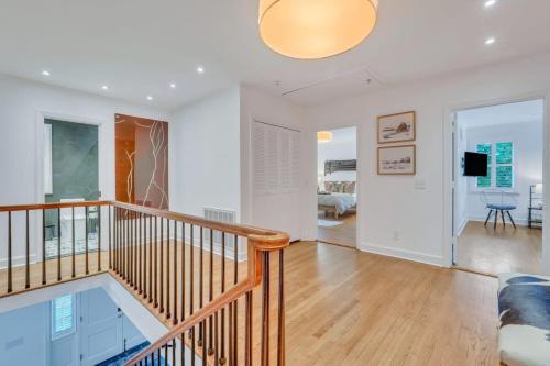 a large living room with a staircase and a living room at The Grey - Large Eclectic and Quiet Home in Statesboro