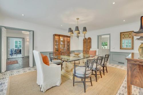 a dining room with a table and chairs at The Grey - Large Eclectic and Quiet Home in Statesboro