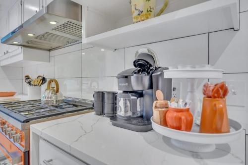 a kitchen with a coffee maker on a counter at The Grey - Large Eclectic and Quiet Home in Statesboro
