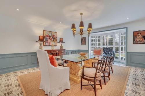 a dining room with a table and chairs at The Grey - Large Eclectic and Quiet Home in Statesboro