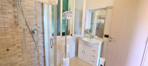 a bathroom with a shower and a sink and a mirror at Antico Principato di Seborga in Vallebona
