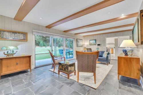 a living room with a couch and a table at The Grey - Large Eclectic and Quiet Home in Statesboro