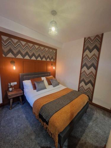 a bedroom with a large bed in a room at The Coastal Hideaway in Bridlington