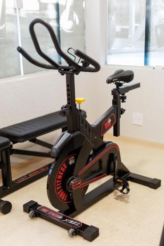 a exercise bike on the floor in a room at Tonello Business Hotel in Campo Mourão