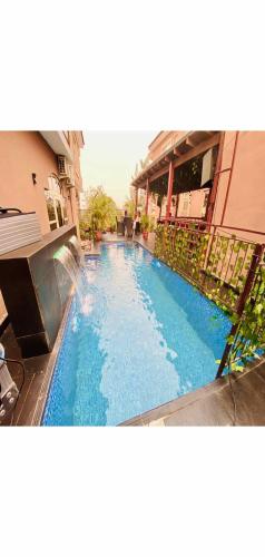 a large blue swimming pool in a building at Hotel Fountain Blu in Abeokuta