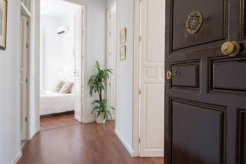 Un ou plusieurs lits dans un hébergement de l'établissement Sunny Málaga Apartments