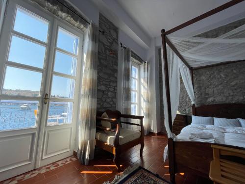 Postel nebo postele na pokoji v ubytování Anamar Symi Residences