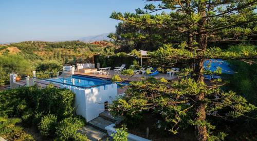 an aerial view of a villa with a swimming pool at Cretan Castle Villas in Chania Town