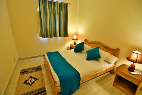 Postel nebo postele na pokoji v ubytování Sheikh Ali Dahab Resort