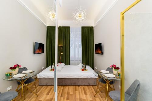 Llit o llits en una habitació de Jacuzzi Berka Apartamenty