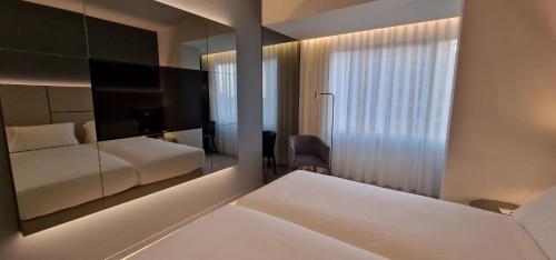 Letto o letti in una camera di Oca Bom Sucesso Hotel