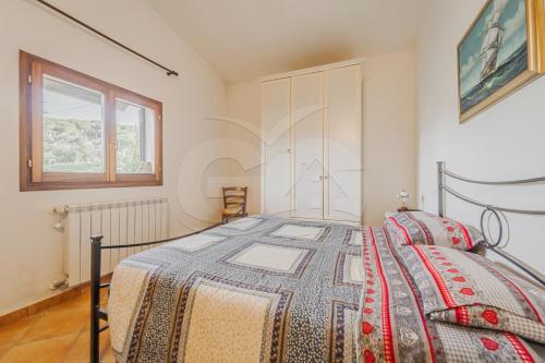 En eller flere senge i et værelse på Villino Girasole - Goelba