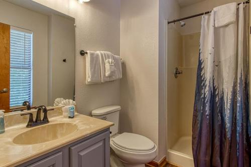 a bathroom with a sink and a toilet and a shower at Pool-Pinecrest Townhomes-1King2Queen- RENOVATED in Pigeon Forge