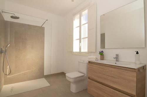 a bathroom with a toilet and a sink and a shower at 269 Son Moro ETV7750 by Mallorca Charme in Muro