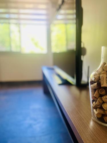a vase filled with rocks on top of a table at La Sofia Apart & Wines in Mendoza