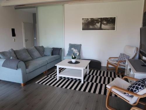 a living room with a couch and a coffee table at Holiday Home Sternenhimmel by Interhome in Schwanau