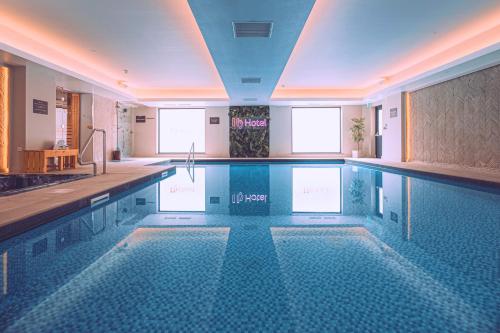 a large swimming pool in a hotel room at Hy Lytham St Anne's in Lytham St Annes