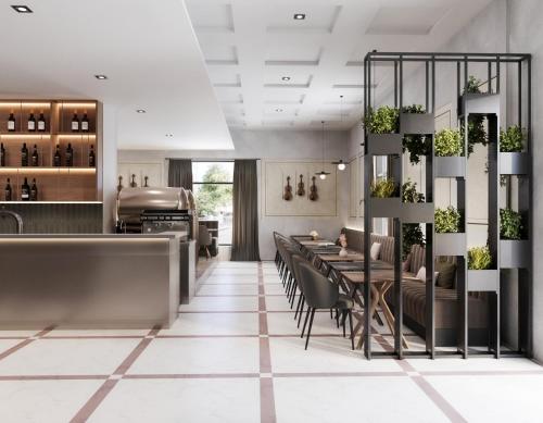 a dining room with a table and chairs at Maestro by Adrez in Prague