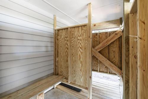 a wooden interior of a sauna with wooden walls at Genuine Holden Beach Ocean front with private pool and great beach views in Holden Beach