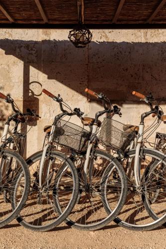 a group of bikes parked next to a wall at Masseria Brigantino in Torre Canne