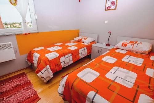 Postel nebo postele na pokoji v ubytování Apartments House Vesna Valmade
