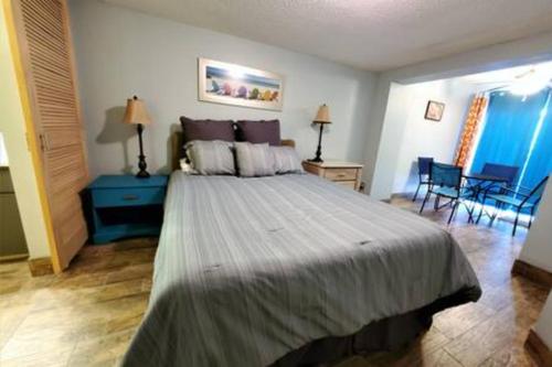 a bedroom with a large bed in a room at Atrium Condo Oceanview - Sleeps 4 Guests 107 in Cape Canaveral