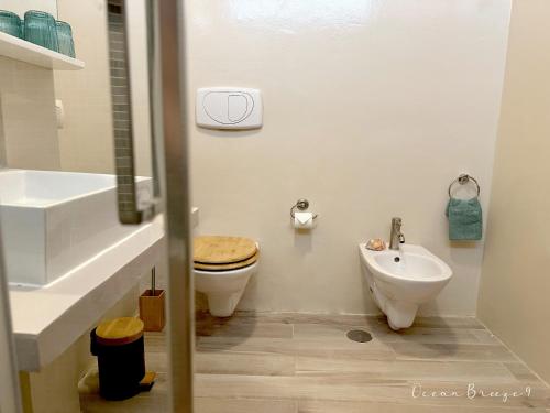 a bathroom with a toilet and a sink at Ocean Breeze 9 in Sal Rei