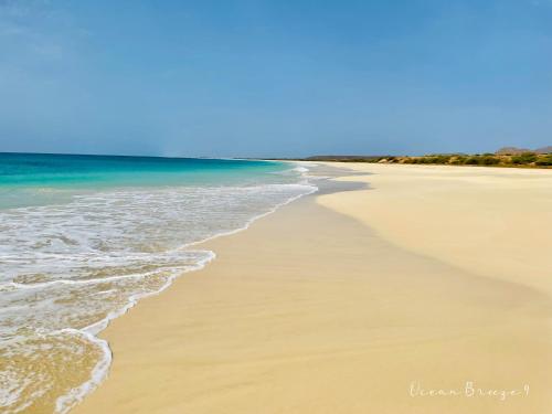 a beach with the ocean and a blue sky at Ocean Breeze 9 in Sal Rei