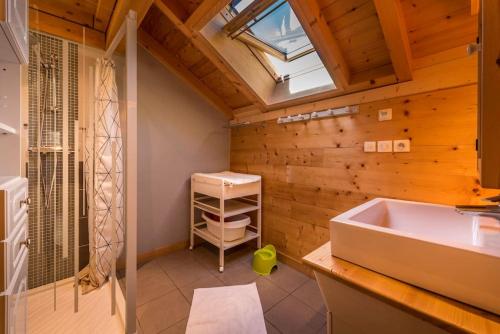 a bathroom with a sink and a bath tub at Chalet Bon Amour in Saint-Sorlin-dʼArves