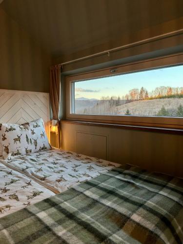 Ένα ή περισσότερα κρεβάτια σε δωμάτιο στο Lagom Lodge