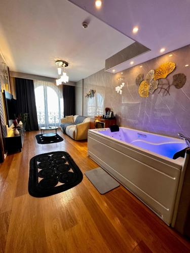 a large bathroom with a large tub in a room at SABİHA GOKCEN İSTANBUL HOUSES Airport in Istanbul