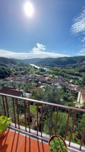 a view of a town from the balcony of a house at Retiro do Viajante in Penacova