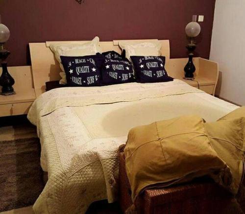 a bedroom with a large bed with pillows on it at Propriete de 3 chambres avec piscine partagee jacuzzi et wifi a Chauffry in Chauffry