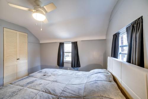 a bedroom with a large bed and a window at Penn Hills Home about 11 Mi to Pittsburgh in Churchill Valley