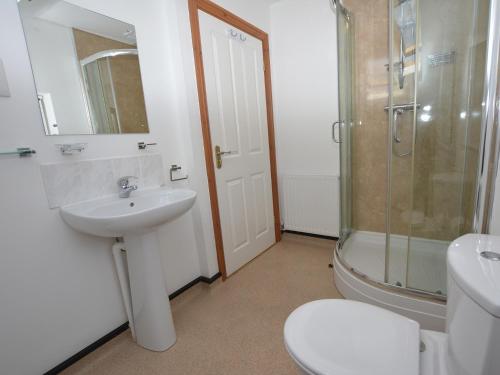 a bathroom with a sink and a shower and a toilet at 2 Bed in Gower 40481 in Dunvant