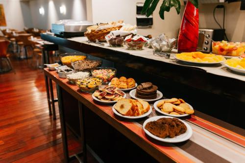a buffet line with many different types of food at BENS - Recoleta Park in Buenos Aires