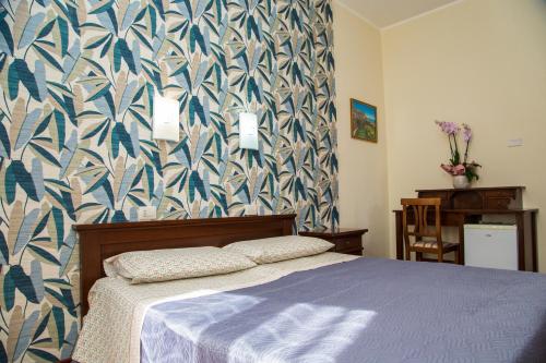 Postel nebo postele na pokoji v ubytování La Borgata Rooms