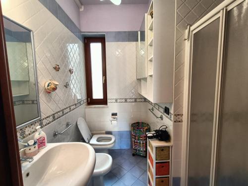 a bathroom with a sink and a toilet at Residence Rosa Virginia Fronte Mare by Salentoville Gallipoli in Gallipoli